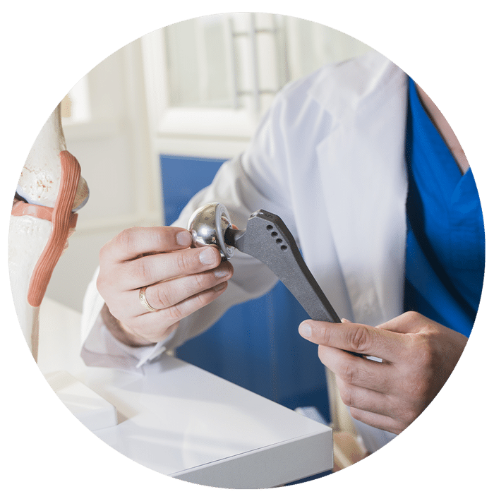 Minivasive-Joint-Replacement-1 Doctor Holding a Joint Replacement