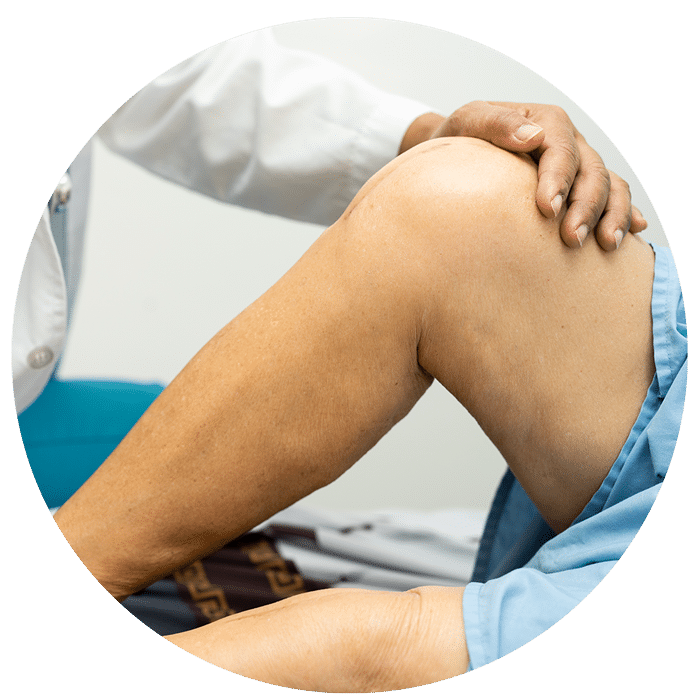 Minivasive-Joint-Replacement-2 Doctor Examining Patient's Newly Replaced Joint
